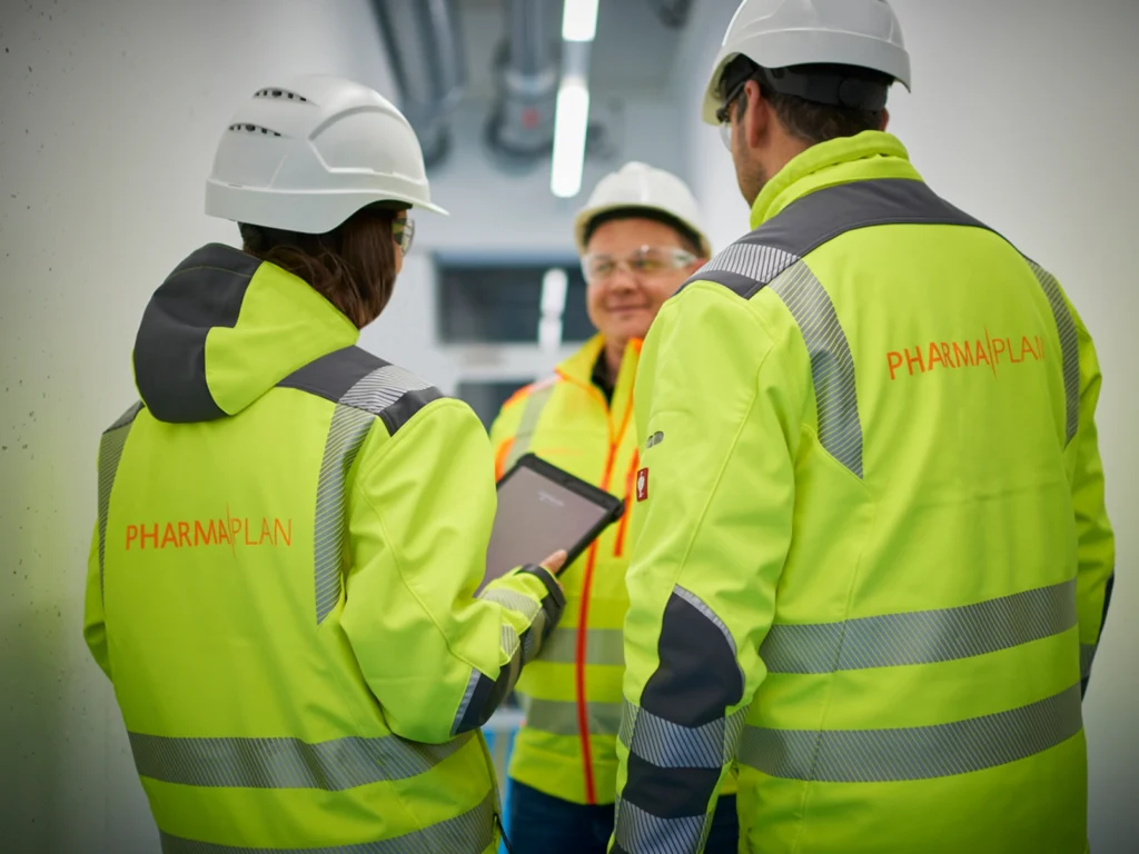 Workers ensuring safety measures at a construction site